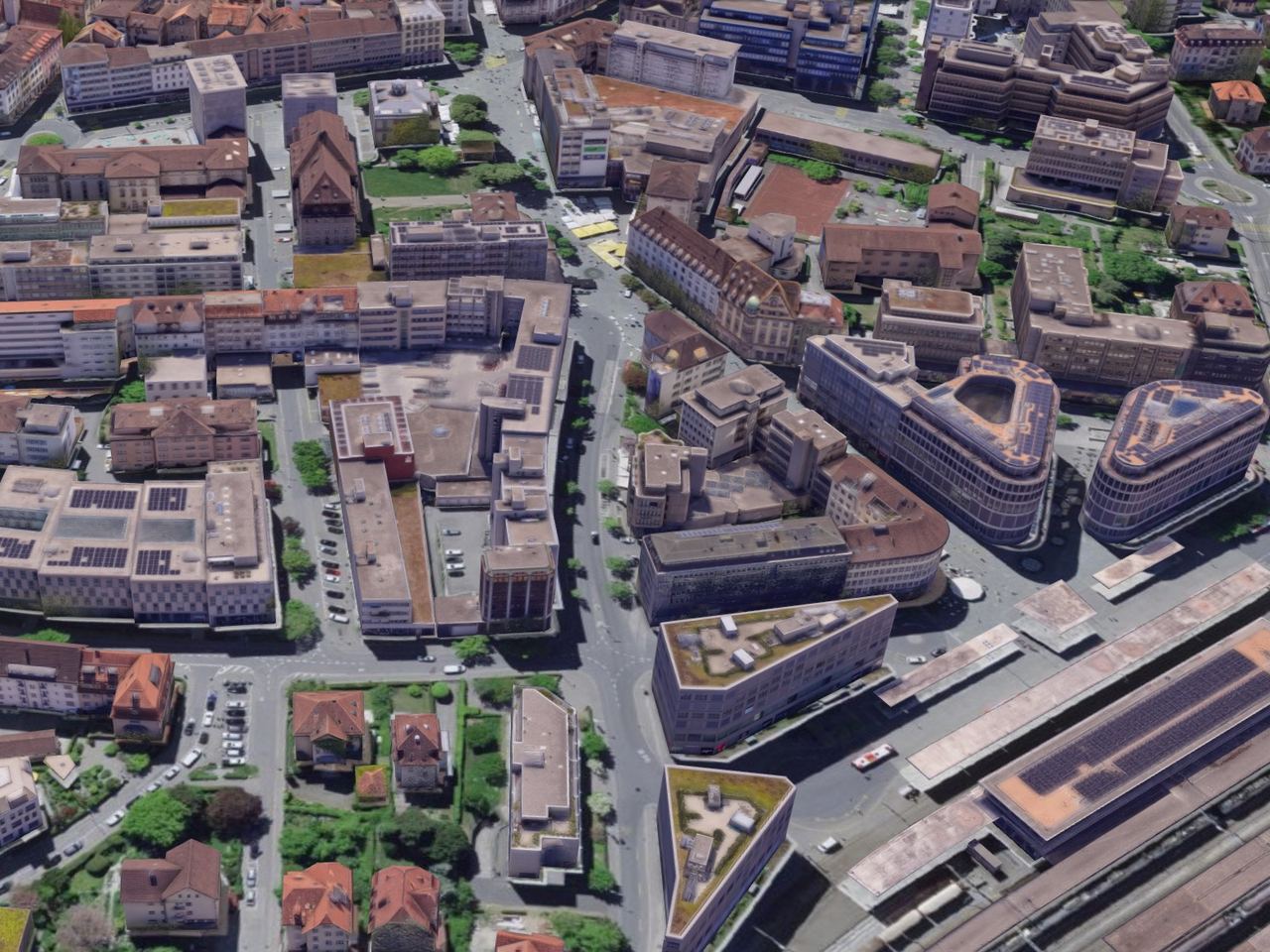 Texturiertes Stadtmodell der Churer Innenstadt aus dem Schrägblick, Geschäfts- und Wohnhäuser mit Innenhöfen, Strassen und Bäumen, unten rechts die Dächer des Bahnhofs
