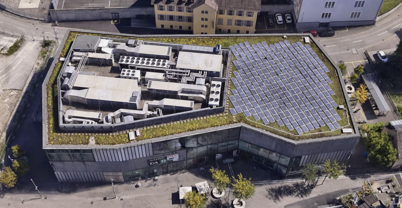 Photorealistic Gaussian splat of a Swiss town from the air, created from a drone survey